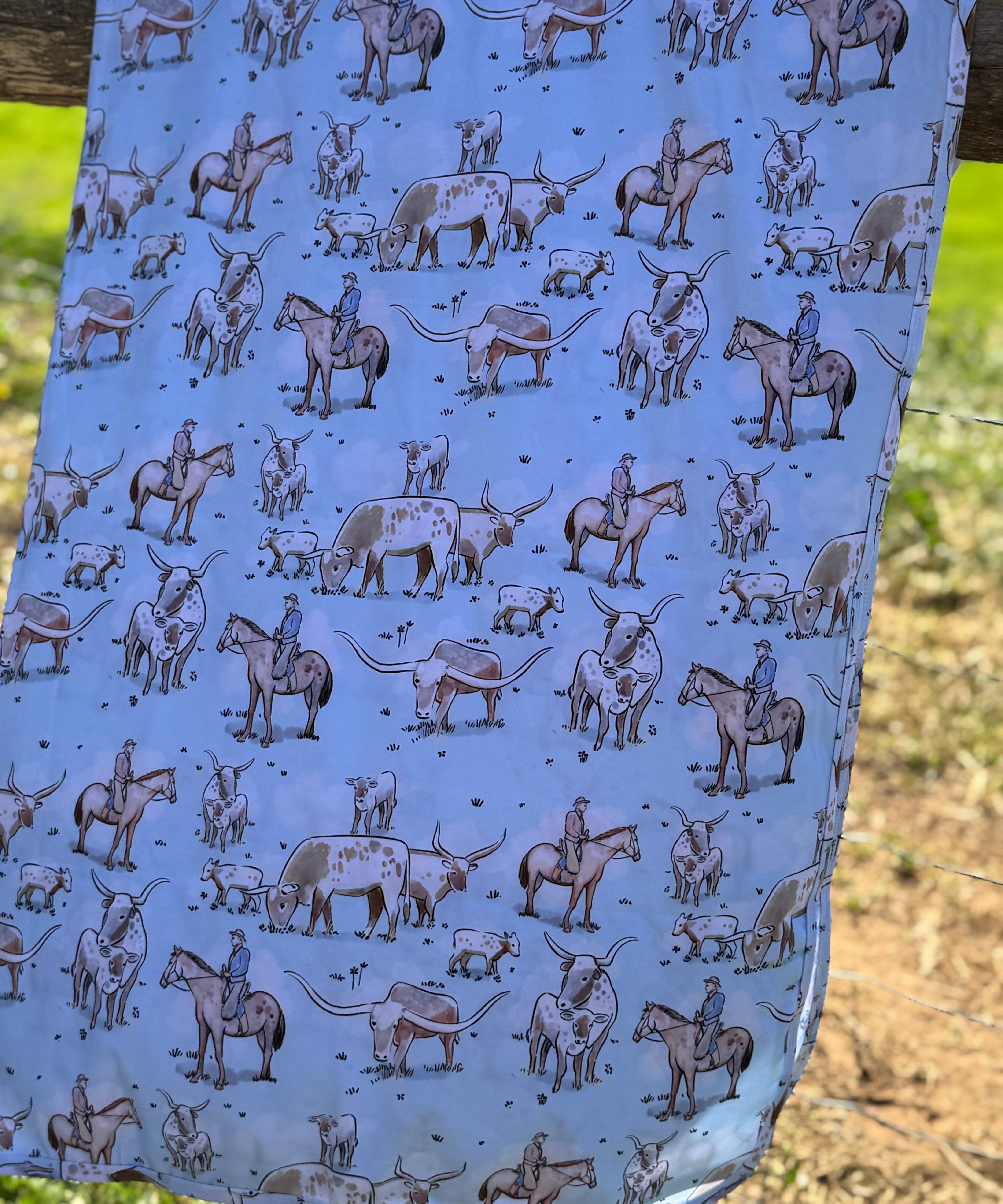 Blue long horn jersey organic cotton swaddle showing classic blue longhorn print on premium organic cotton