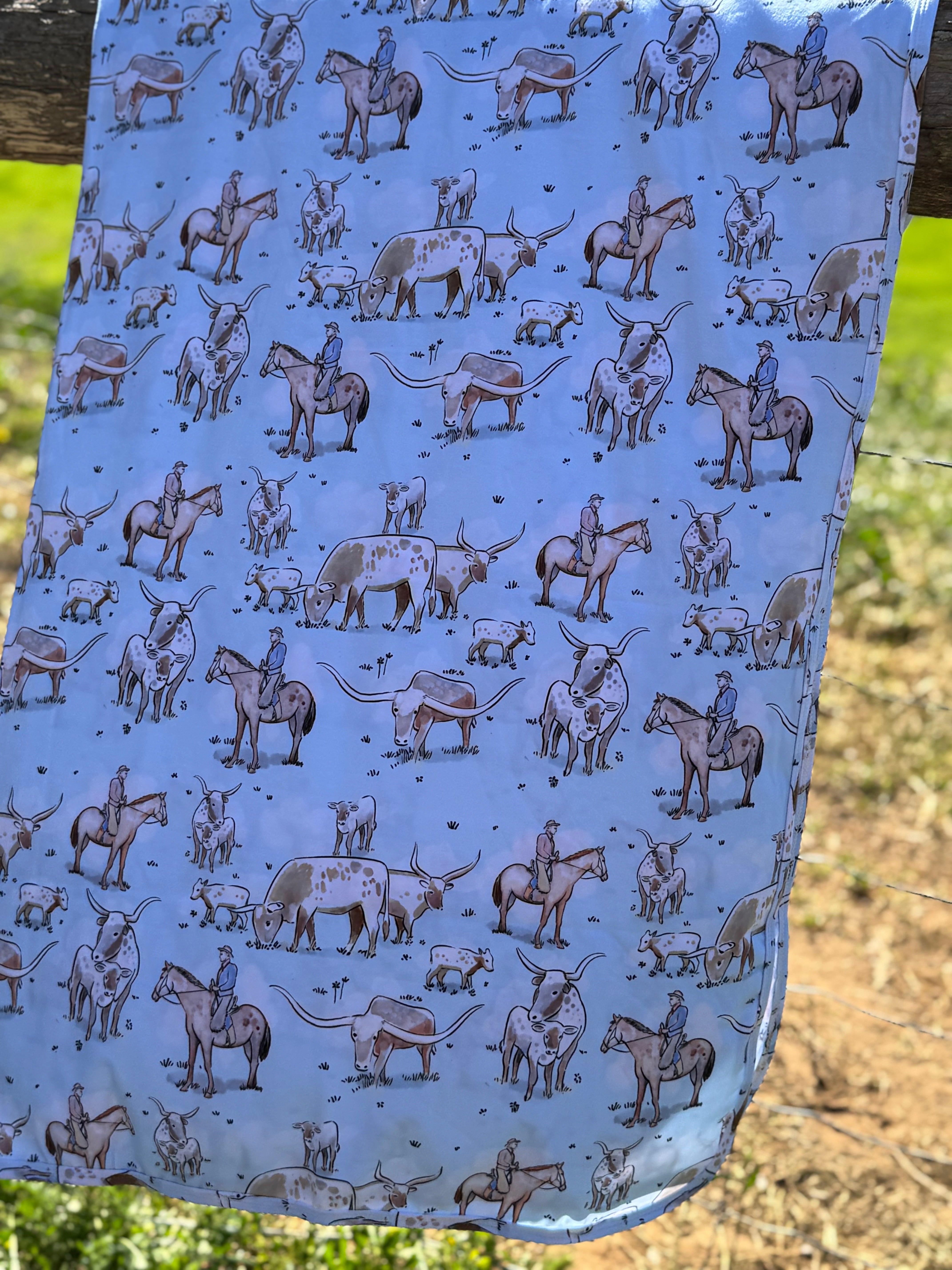 Blue long horn jersey organic cotton swaddle showing classic blue longhorn print on premium organic cotton