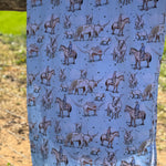 Blue long horn organic cotton swaddle draped showing generous swaddle size for newborns