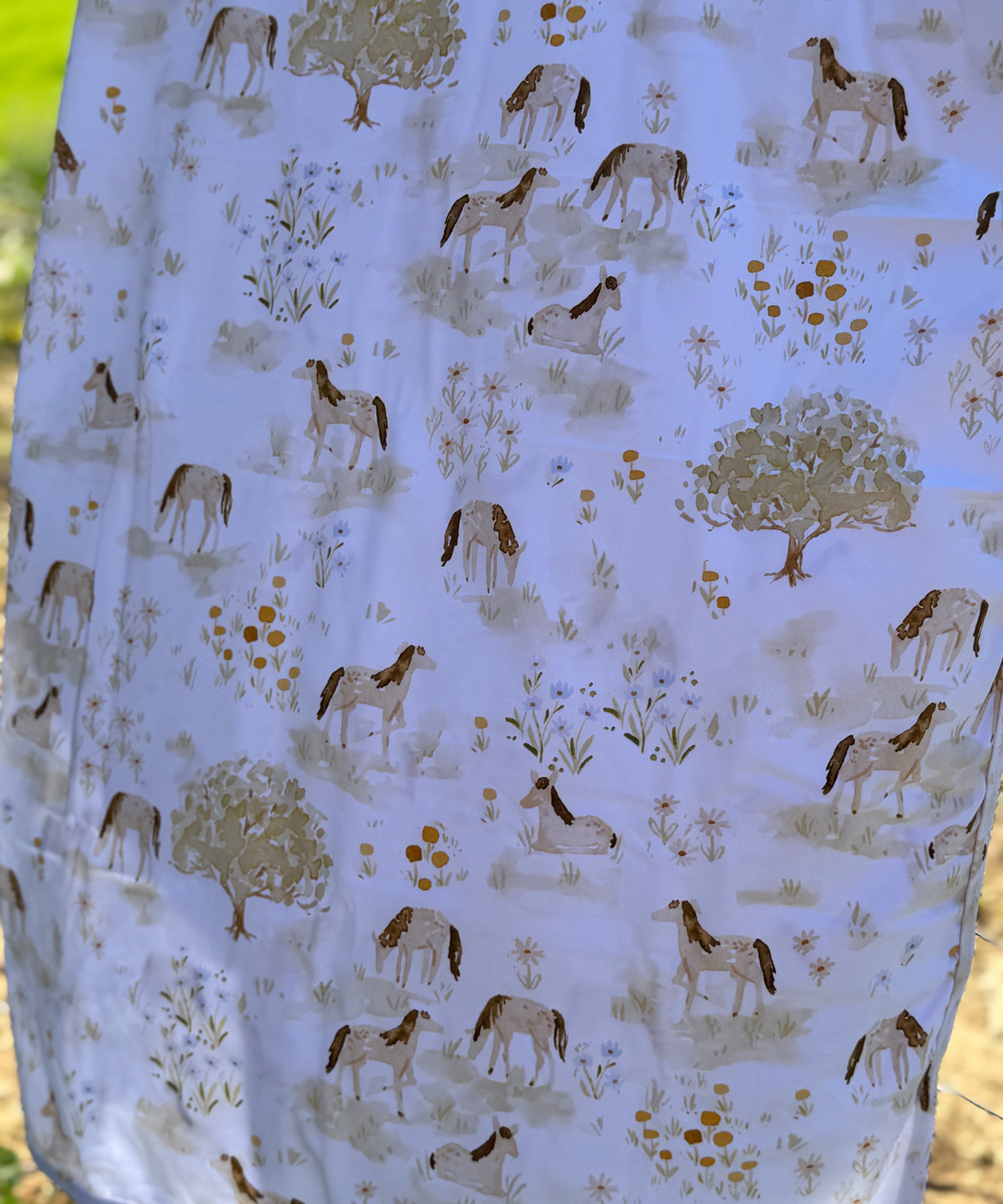Horse field jersey organic cotton swaddle showing beautiful horse in field scene on premium organic cotton