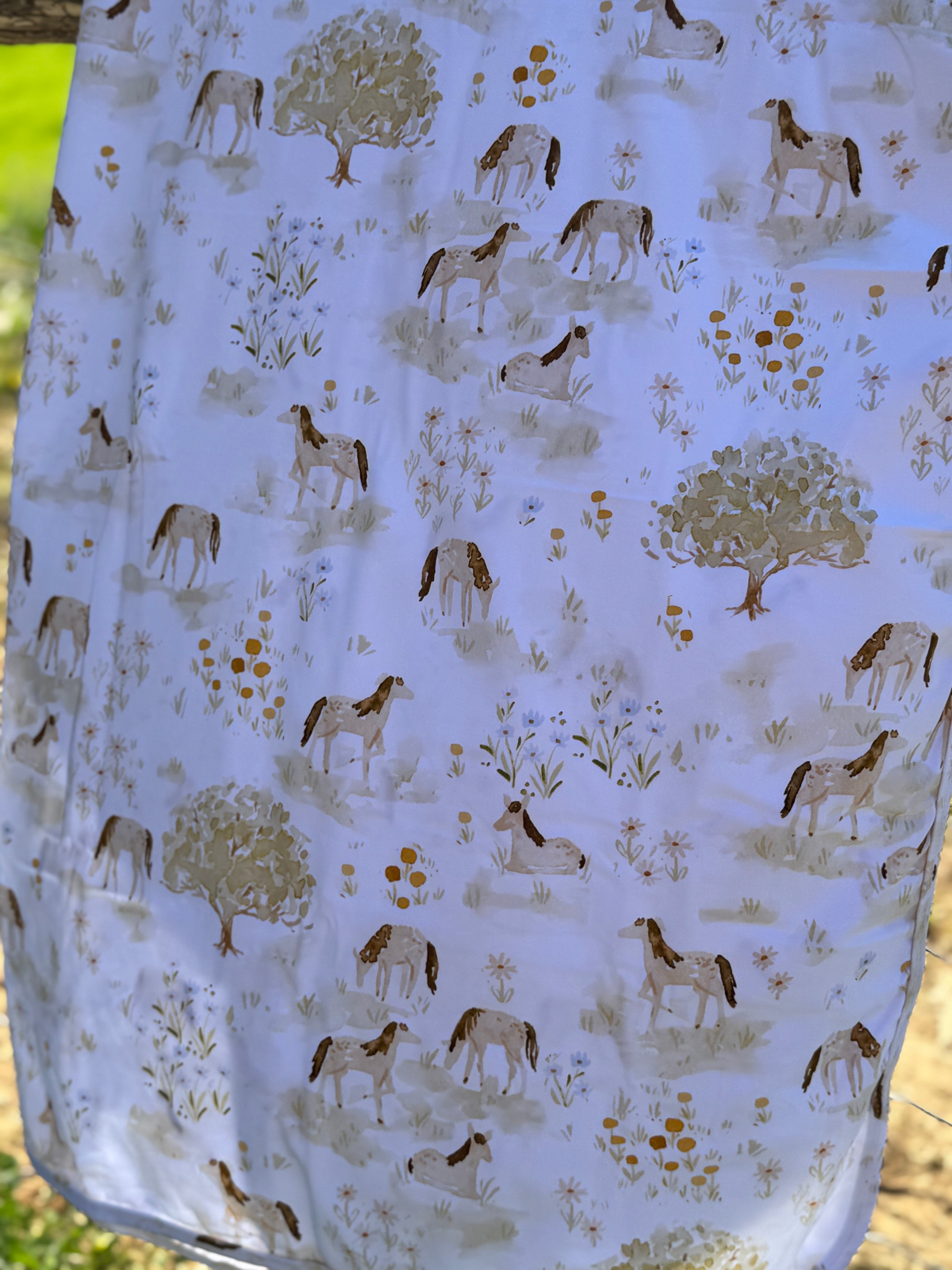 Horse field jersey organic cotton swaddle showing beautiful horse in field scene on premium organic cotton