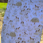 Horse field organic cotton swaddle draped showing generous size for swaddling and wrapping