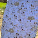 Horse field organic cotton swaddle draped showing generous size for swaddling and wrapping