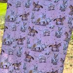 Pink long horn swaddle print close-up showing detailed longhorn motifs on organic jersey cotton