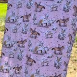 Pink long horn swaddle print close-up showing detailed longhorn motifs on organic jersey cotton