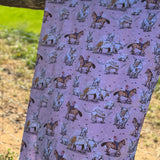 Pink long horn swaddle in use showing cosy newborn wrapped in organic cotton
