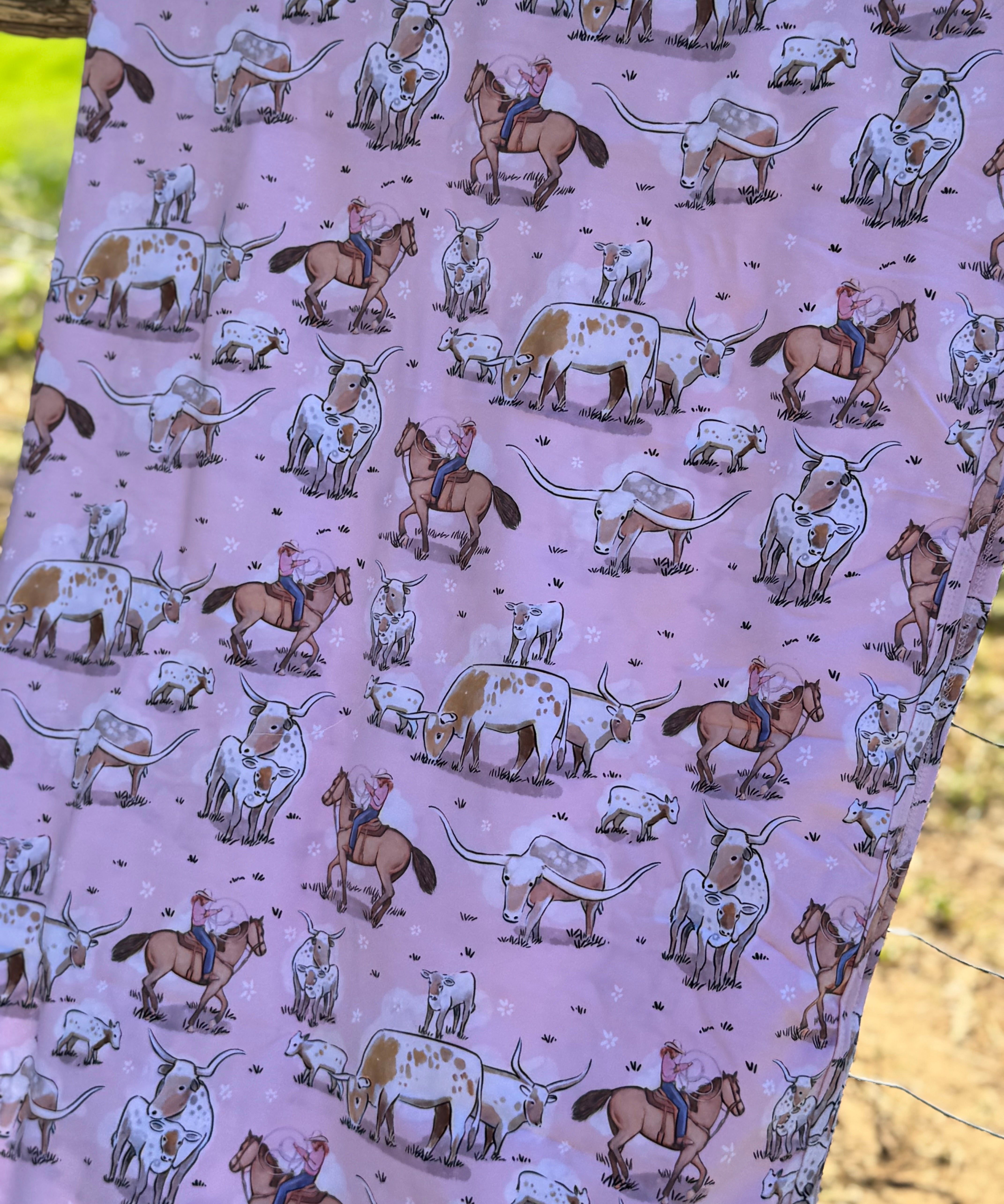 Pink long horn jersey organic cotton swaddle showing beautiful pink longhorn print on premium organic cotton