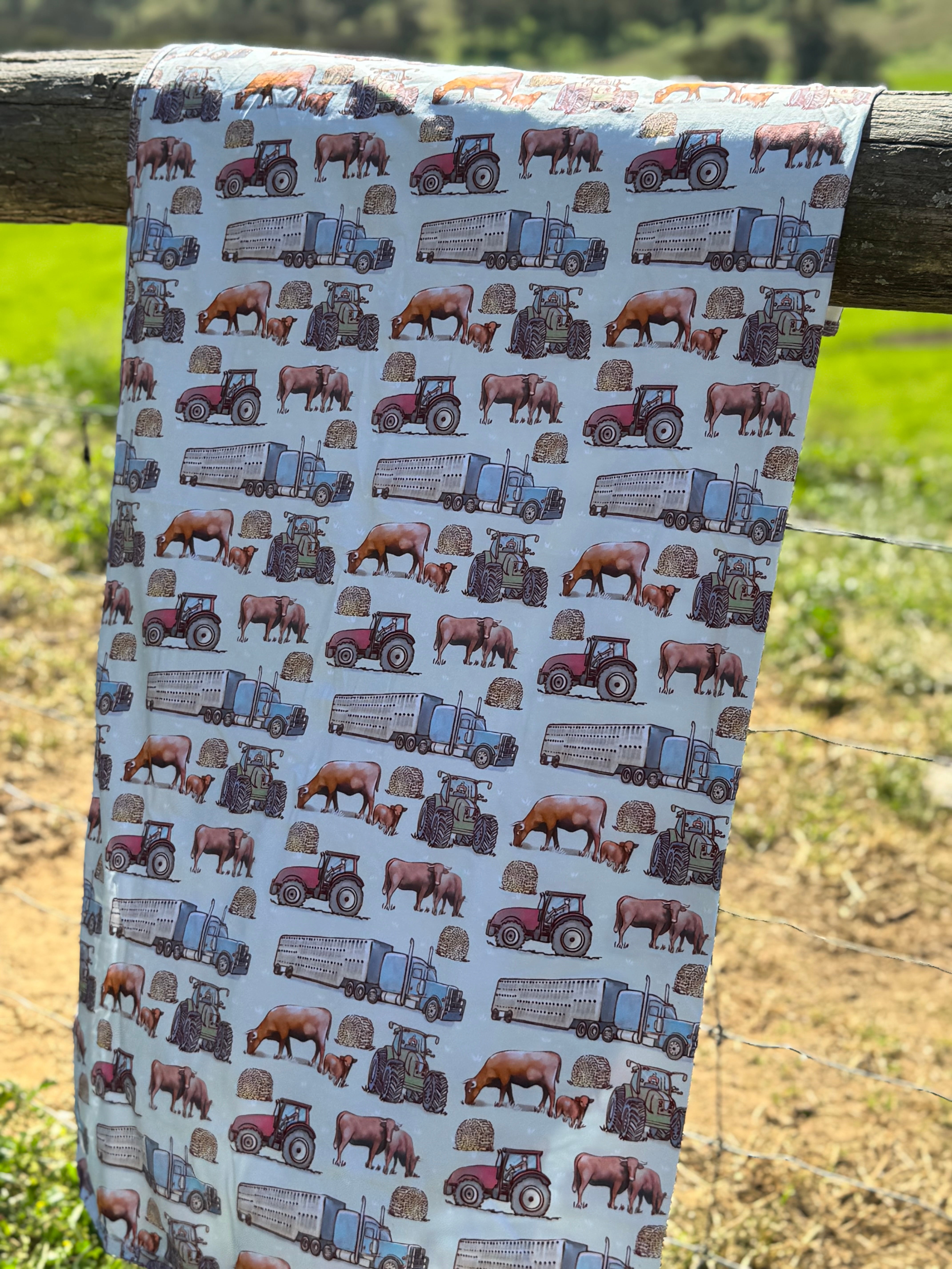 Ranch life organic swaddle open flat lay showing full size and print pattern