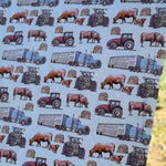 Ranch life swaddle tag detail showing 100% organic cotton certification and care instructions