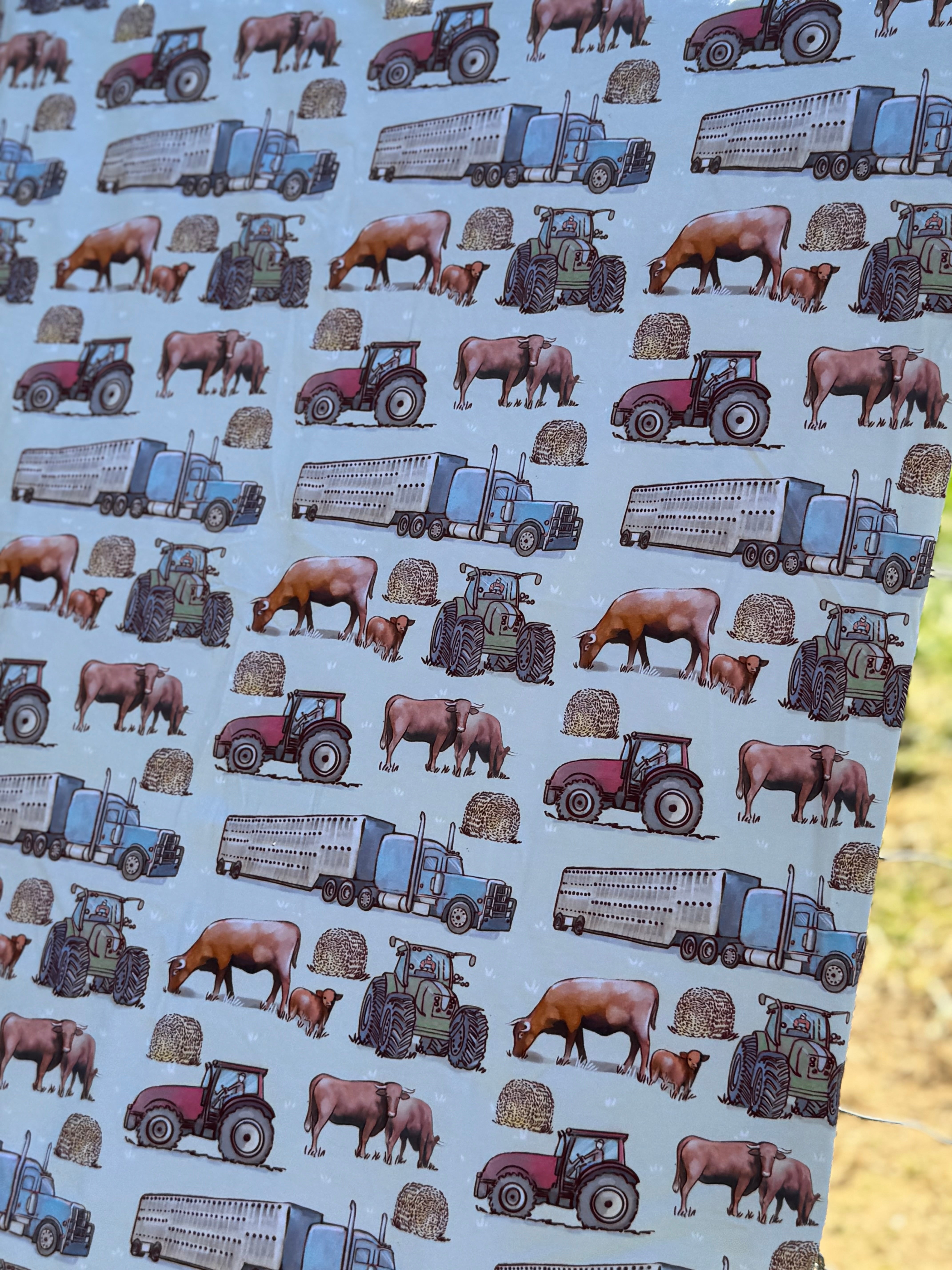 Ranch life swaddle tag detail showing 100% organic cotton certification and care instructions