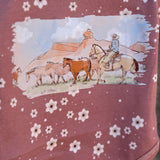 Filly floral jumpsuit worn by girl showing sweet country casual playsuit style