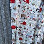 Organic light cotton muslin farm yard swaddle showing charming farm yard scene on breathable organic muslin