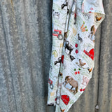 Farm yard organic muslin swaddle draped showing lightweight breathable swaddle for newborns