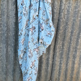 Blue longhorn organic muslin swaddle draped showing lightweight breathable swaddle for warmer weather