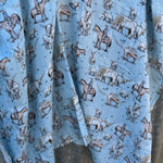 Blue longhorn organic muslin swaddle open flat lay showing full size and delicate print