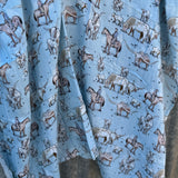 Blue longhorn organic muslin swaddle open flat lay showing full size and delicate print