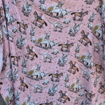 Pink longhorn organic muslin swaddle open flat lay showing full size and charming pink print