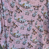 Pink longhorn organic muslin swaddle open flat lay showing full size and charming pink print