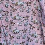 Pink longhorn organic muslin swaddle draped showing lightweight breathable design for warm days