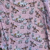 Pink longhorn organic muslin swaddle draped showing lightweight breathable design for warm days