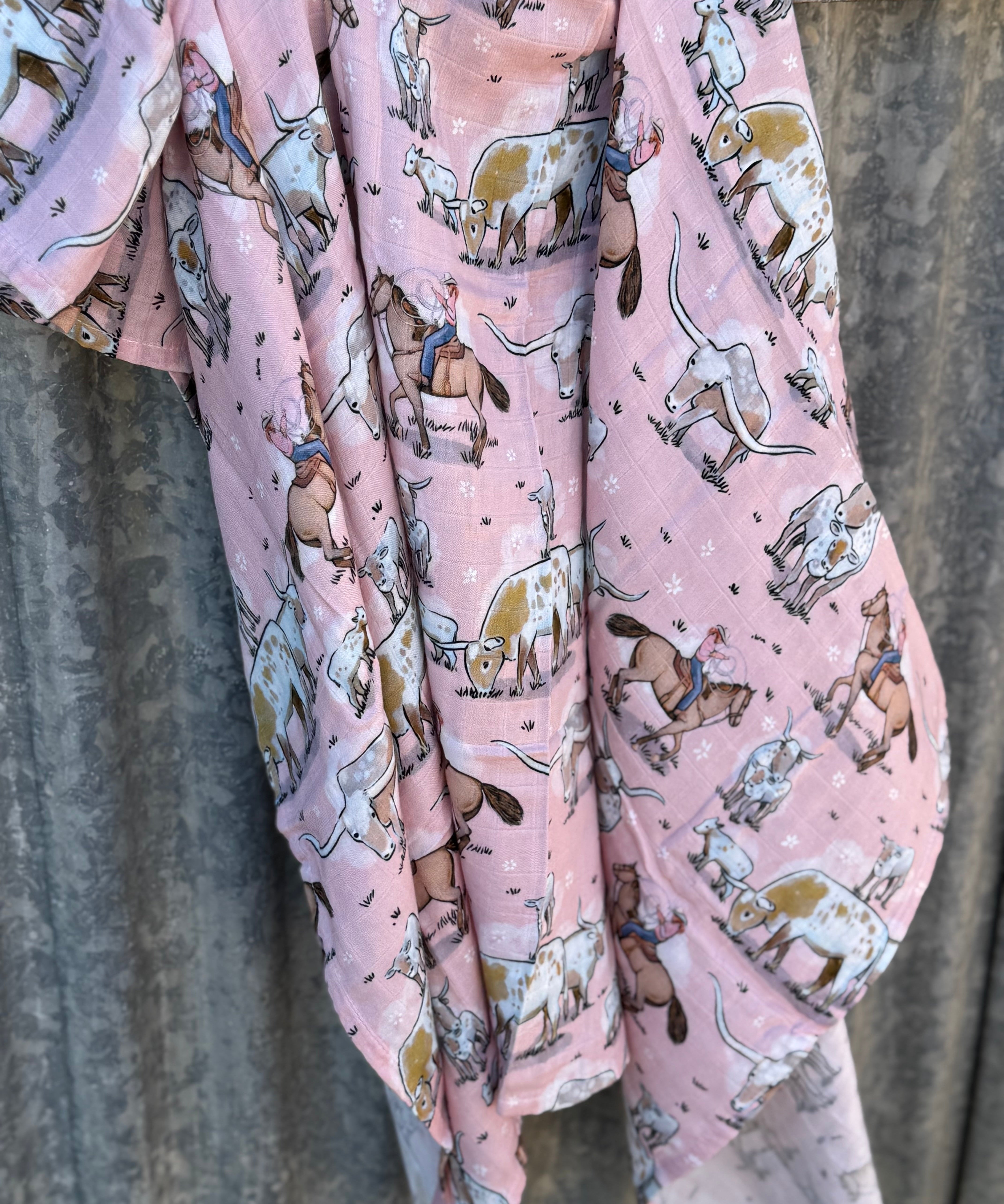 Organic light cotton muslin pink longhorn swaddle showing sweet pink longhorn print on breathable organic muslin