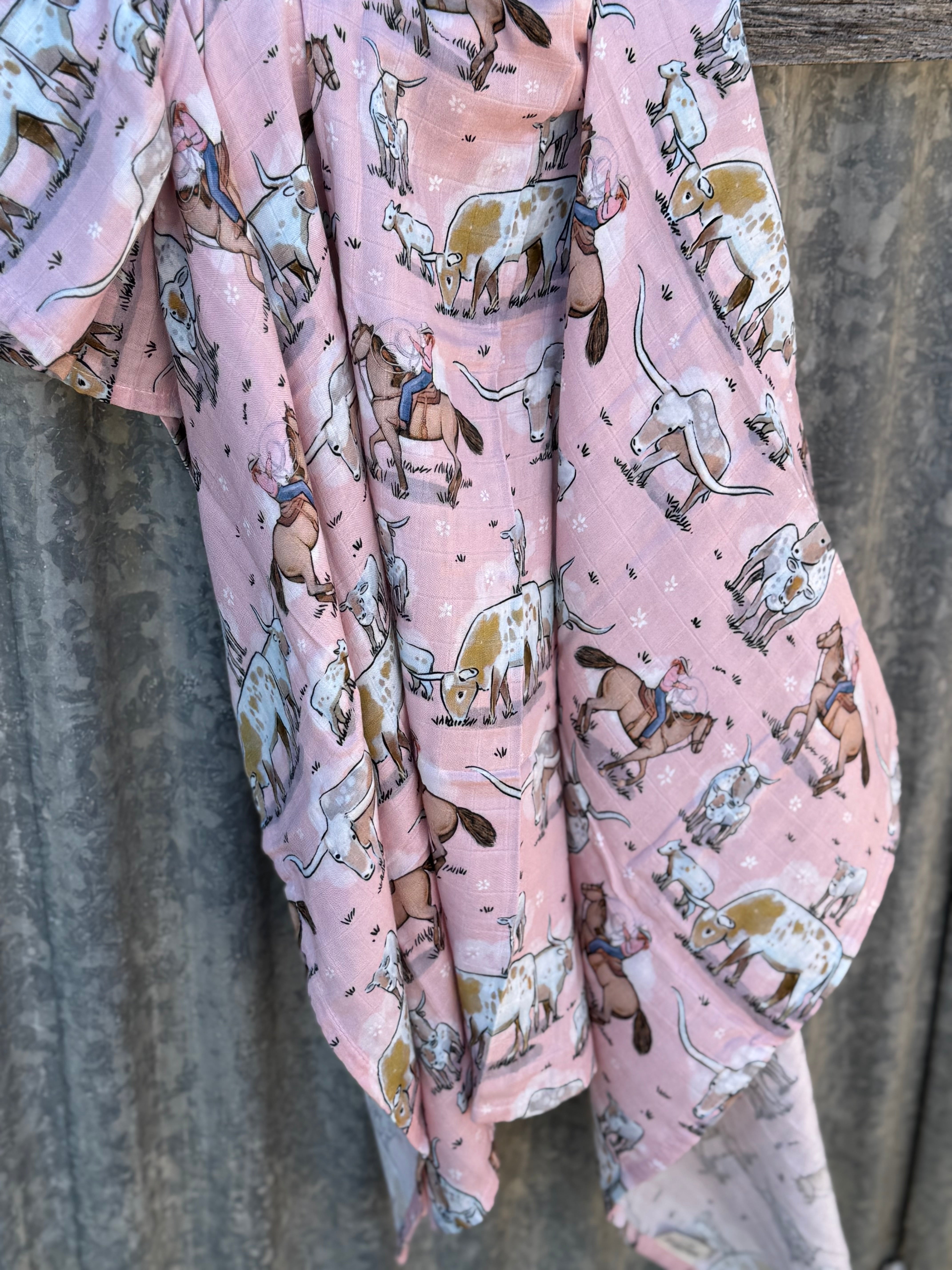 Organic light cotton muslin pink longhorn swaddle showing sweet pink longhorn print on breathable organic muslin