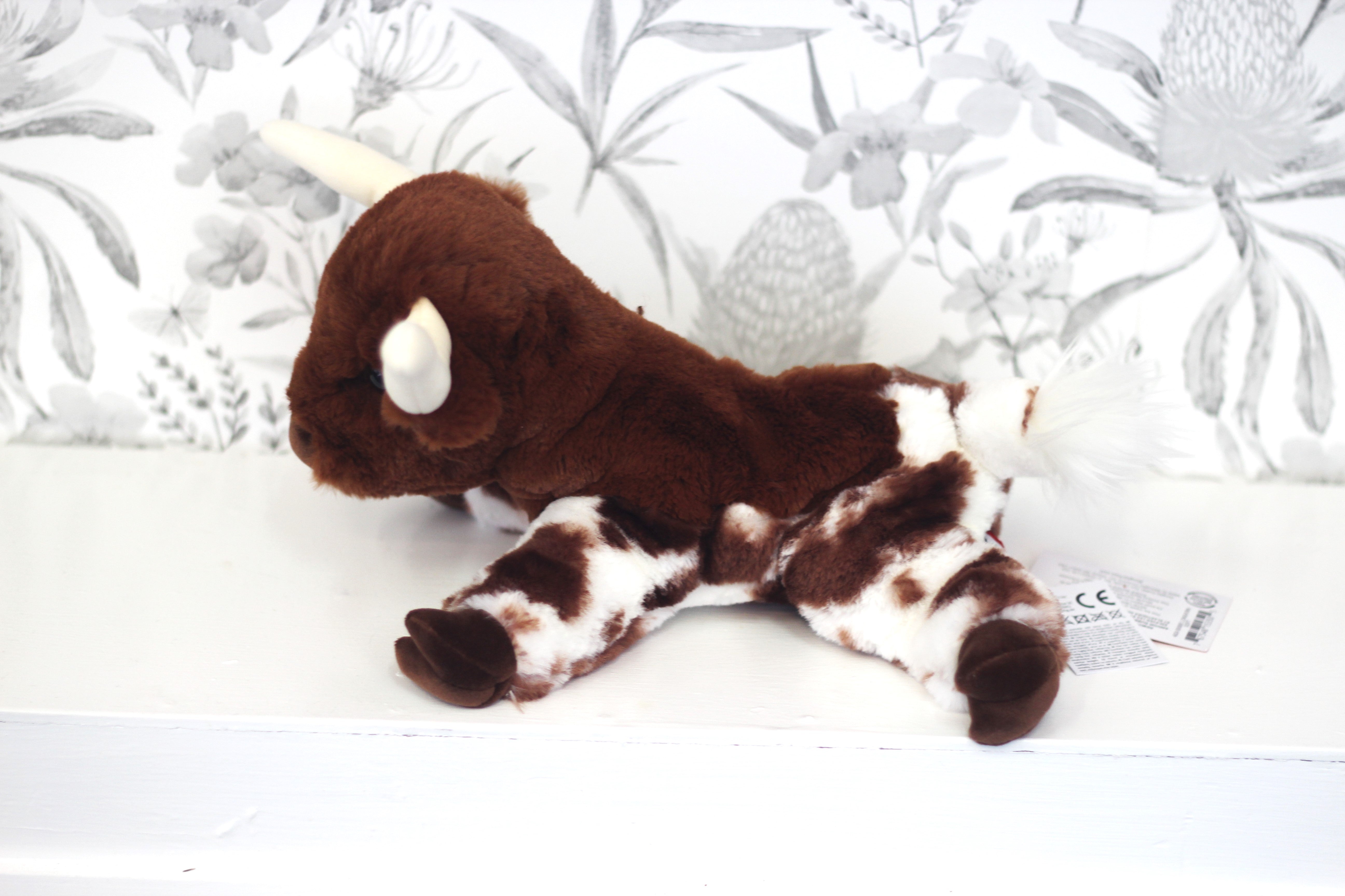 Bixbie soft Texas Long Horn plush held in hands showing cuddly size, ideal country gift for babies