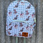 Teal cowgirl backpack side view showing main compartment depth and pocket detail