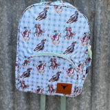 Teal cowgirl backpack side view showing main compartment depth and pocket detail