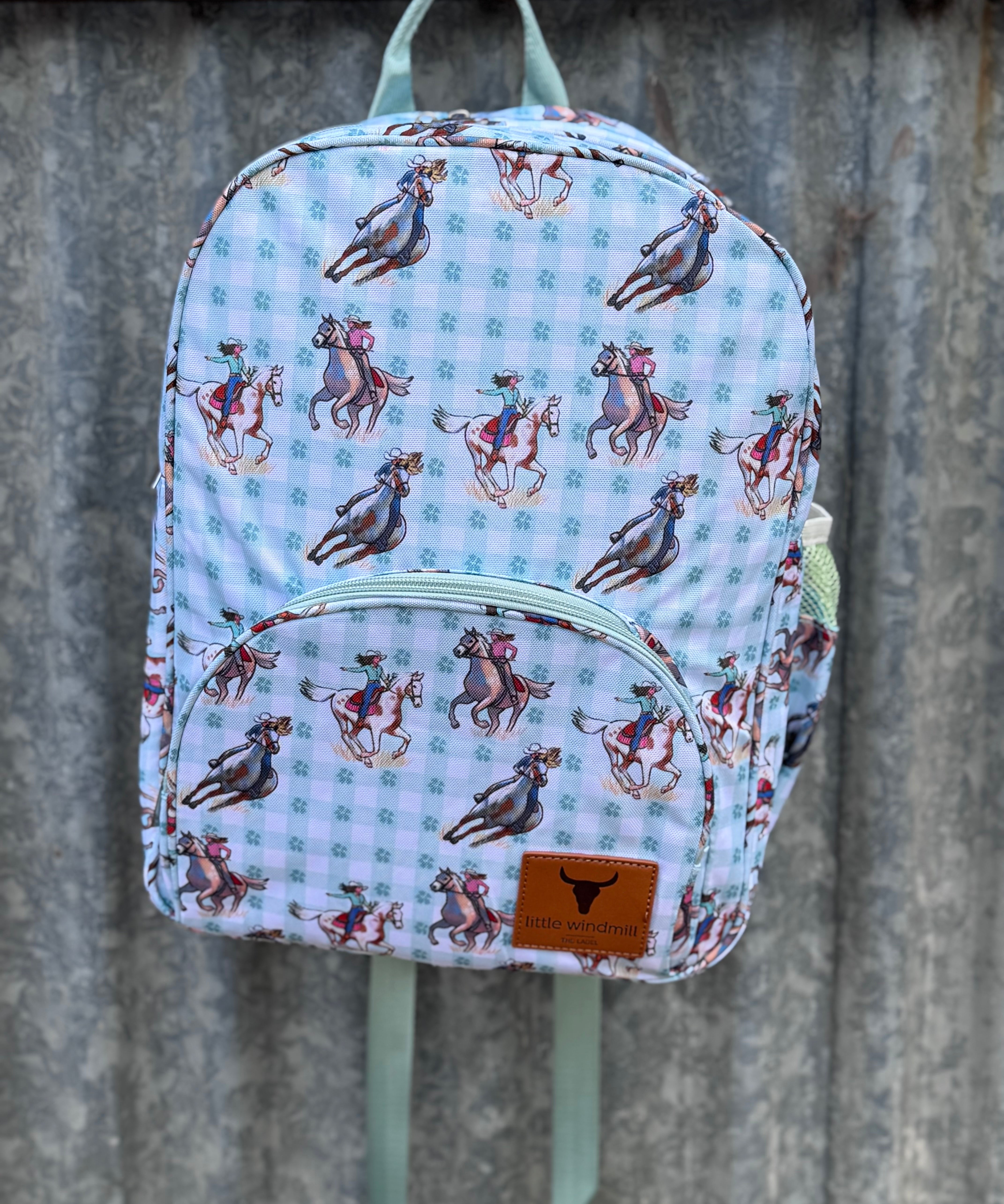 Teal cowgirl backpack side view showing main compartment depth and pocket detail