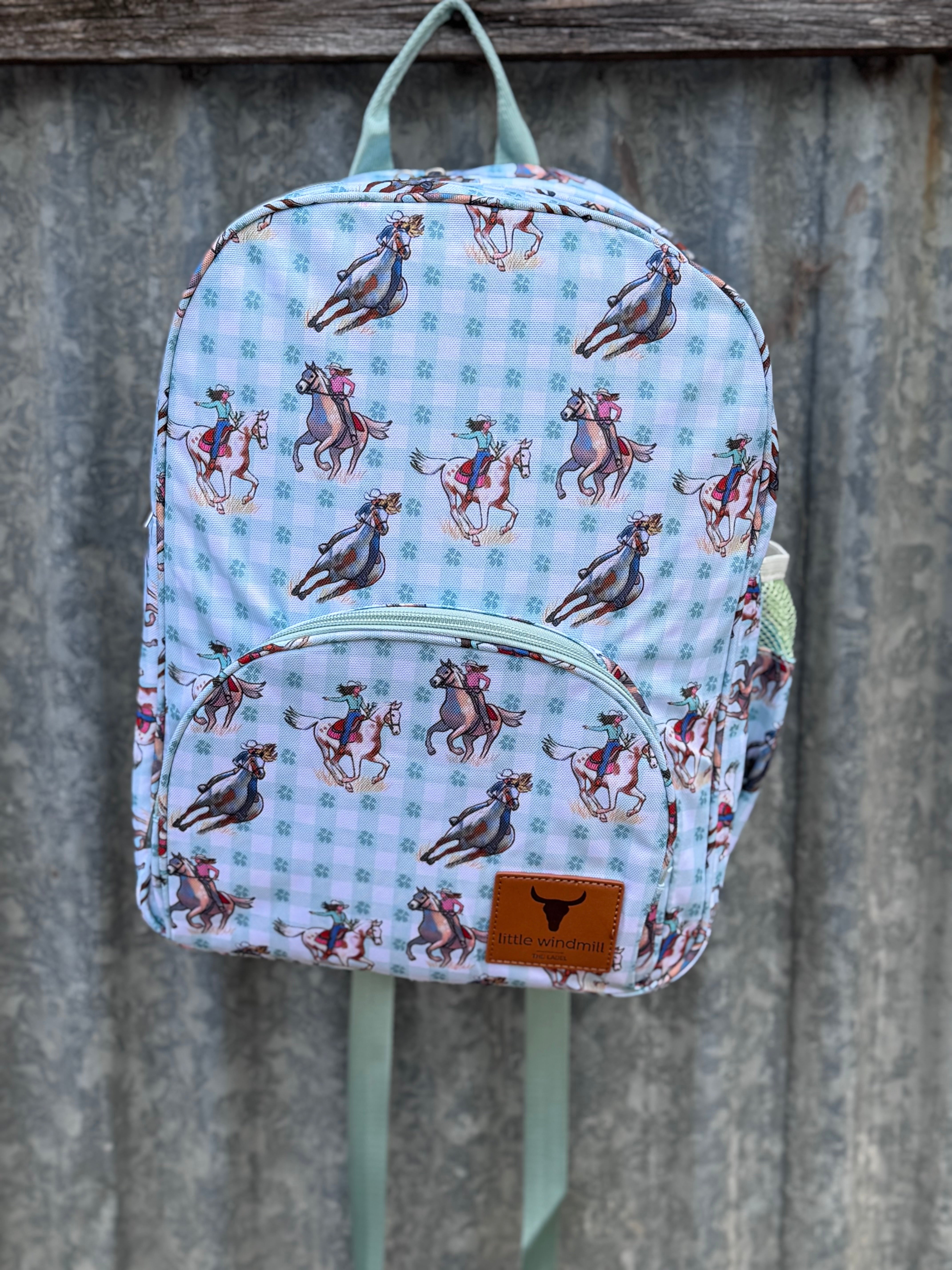 Teal cowgirl backpack side view showing main compartment depth and pocket detail
