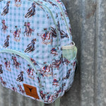 Teal cowgirl backpack print close-up showing detailed teal cowgirl graphic design