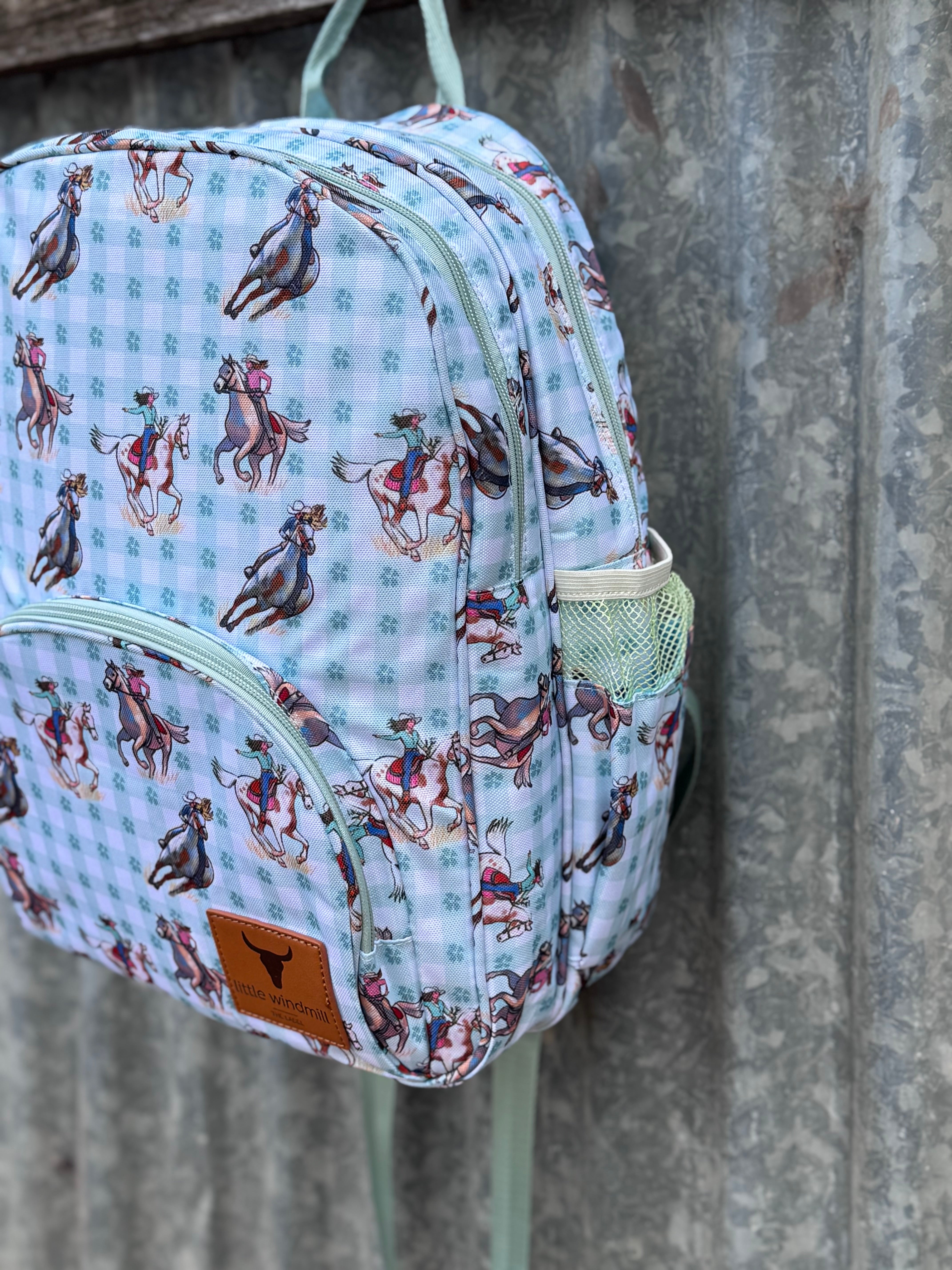 Teal cowgirl backpack print close-up showing detailed teal cowgirl graphic design