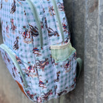 Teal cowgirl backpack open showing organised interior pockets and compartments