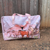 Pastel pink droving duffle bag front view showing sweet pastel pink western droving print travel bag