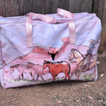 Pastel pink droving duffle bag strap and handle detail showing quality construction