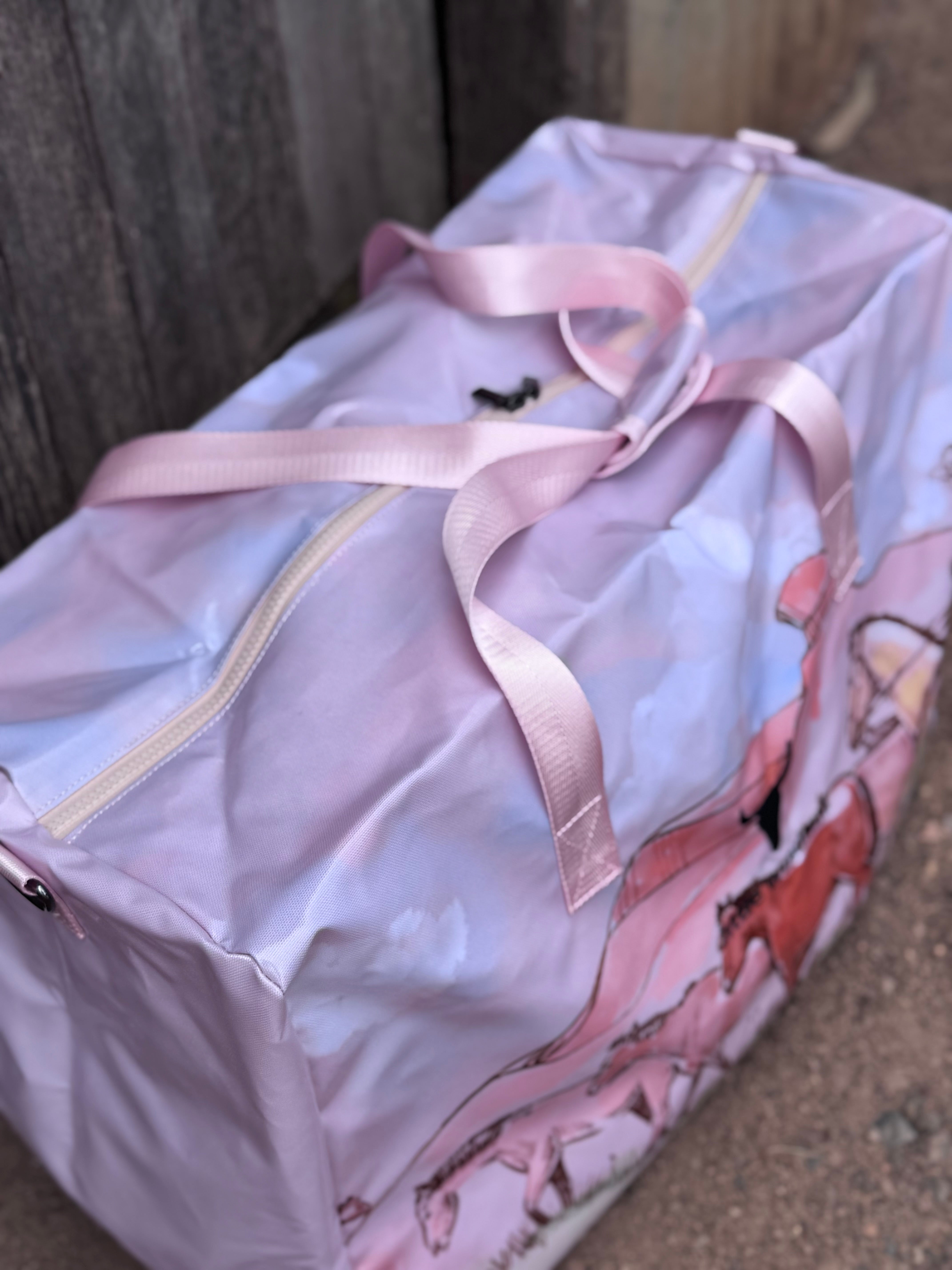 Pastel pink droving duffle bag print close-up showing detailed droving cattle print in pastel pink