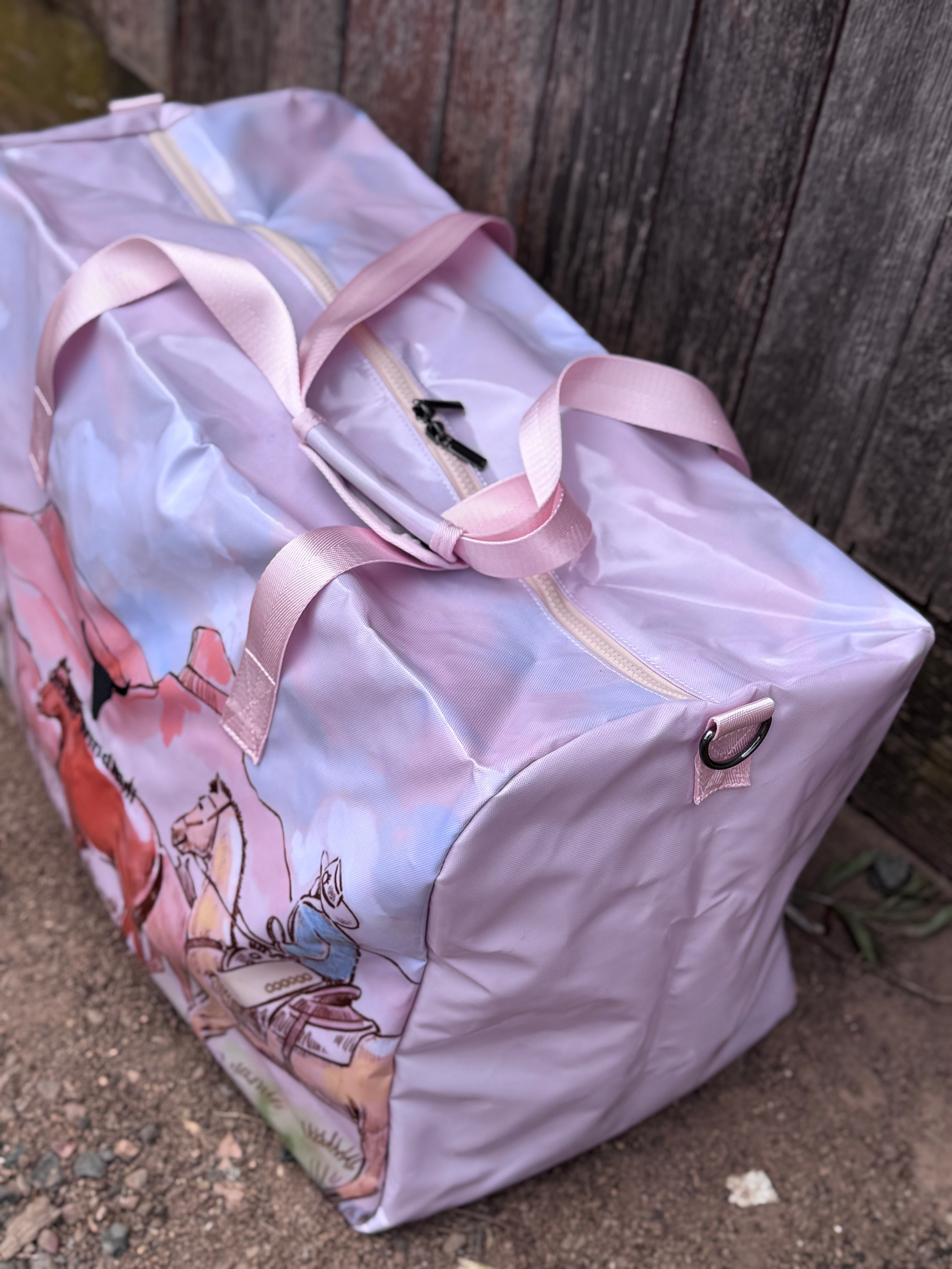 Pastel pink droving duffle bag flatlay showing full western droving design