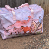 Pastel pink droving duffle bag open showing spacious interior and quality zip closure