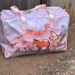 Pastel pink droving duffle bag side view showing roomy compartment and soft pink colourway