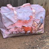 Pastel pink droving duffle bag side view showing roomy compartment and soft pink colourway
