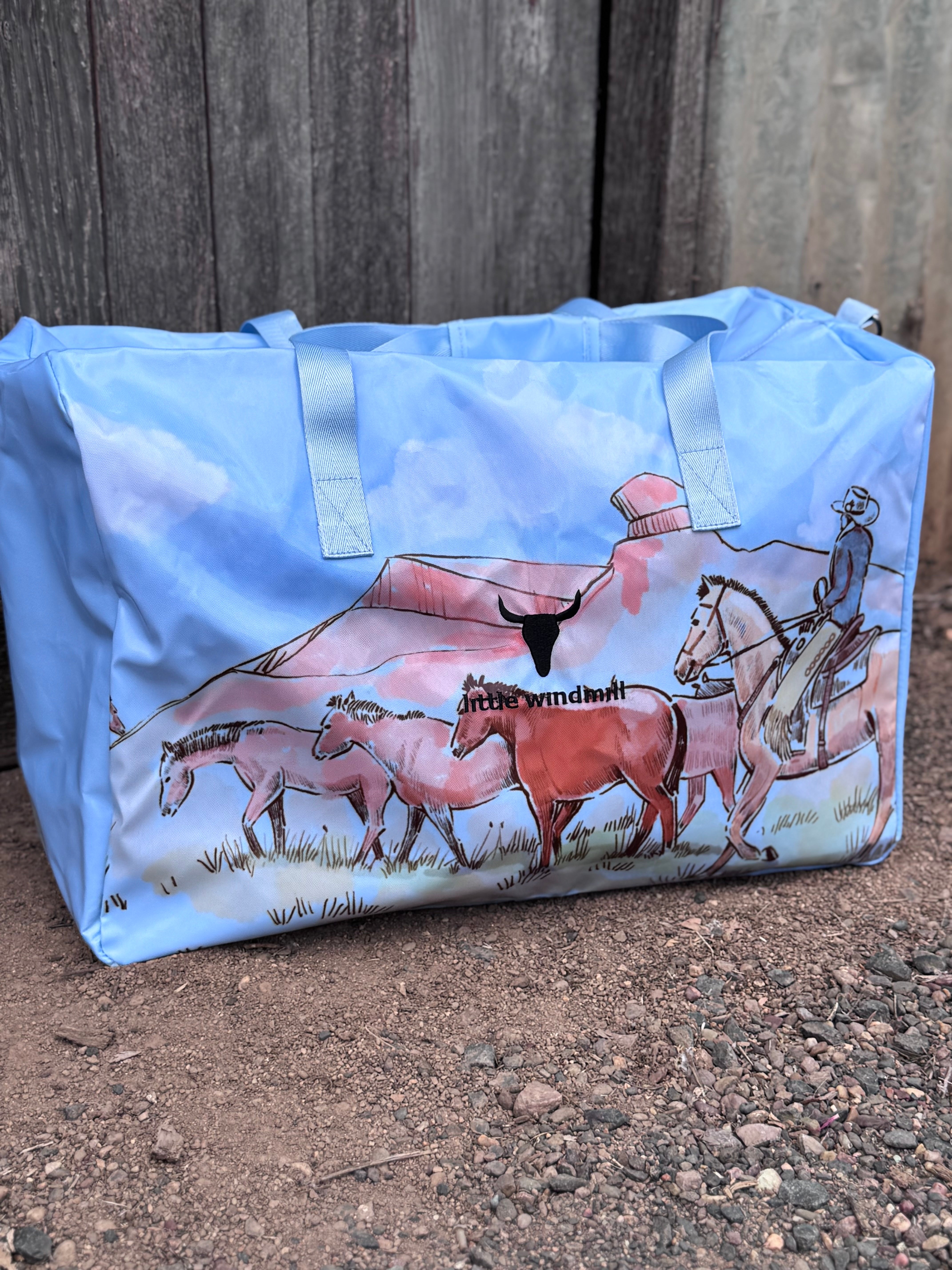 Pastel blue droving duffle bag print close-up showing detailed cattle droving print in pastel blue