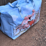 Pastel blue droving duffle bag open showing spacious interior and quality zip closure