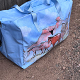 Pastel blue droving duffle bag open showing spacious interior and quality zip closure