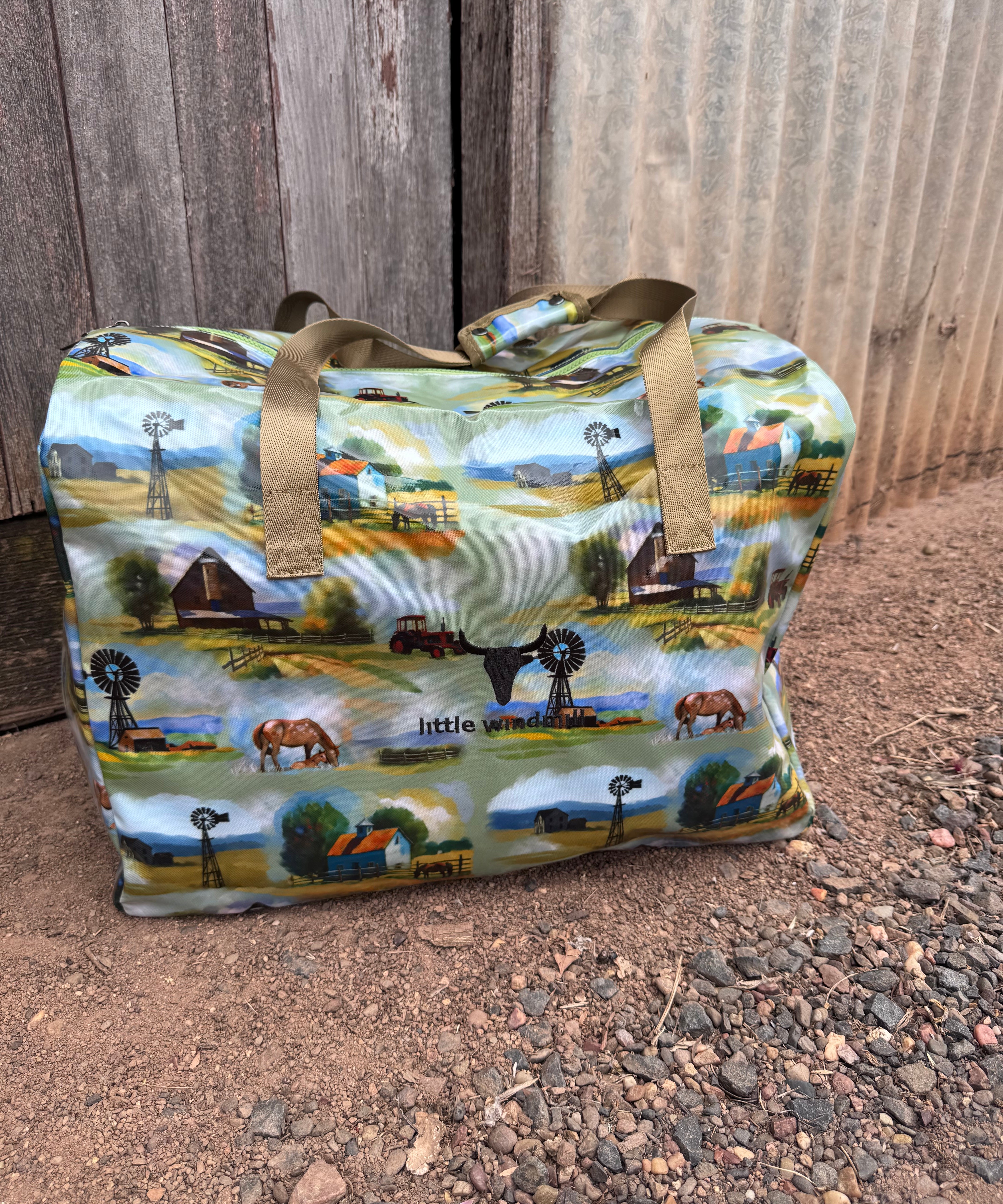 Vintage farm scene duffle bag front view showing nostalgic vintage farm print on quality travel bag