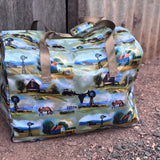 Vintage farm scene duffle bag flatlay showing full nostalgic farm scene print design