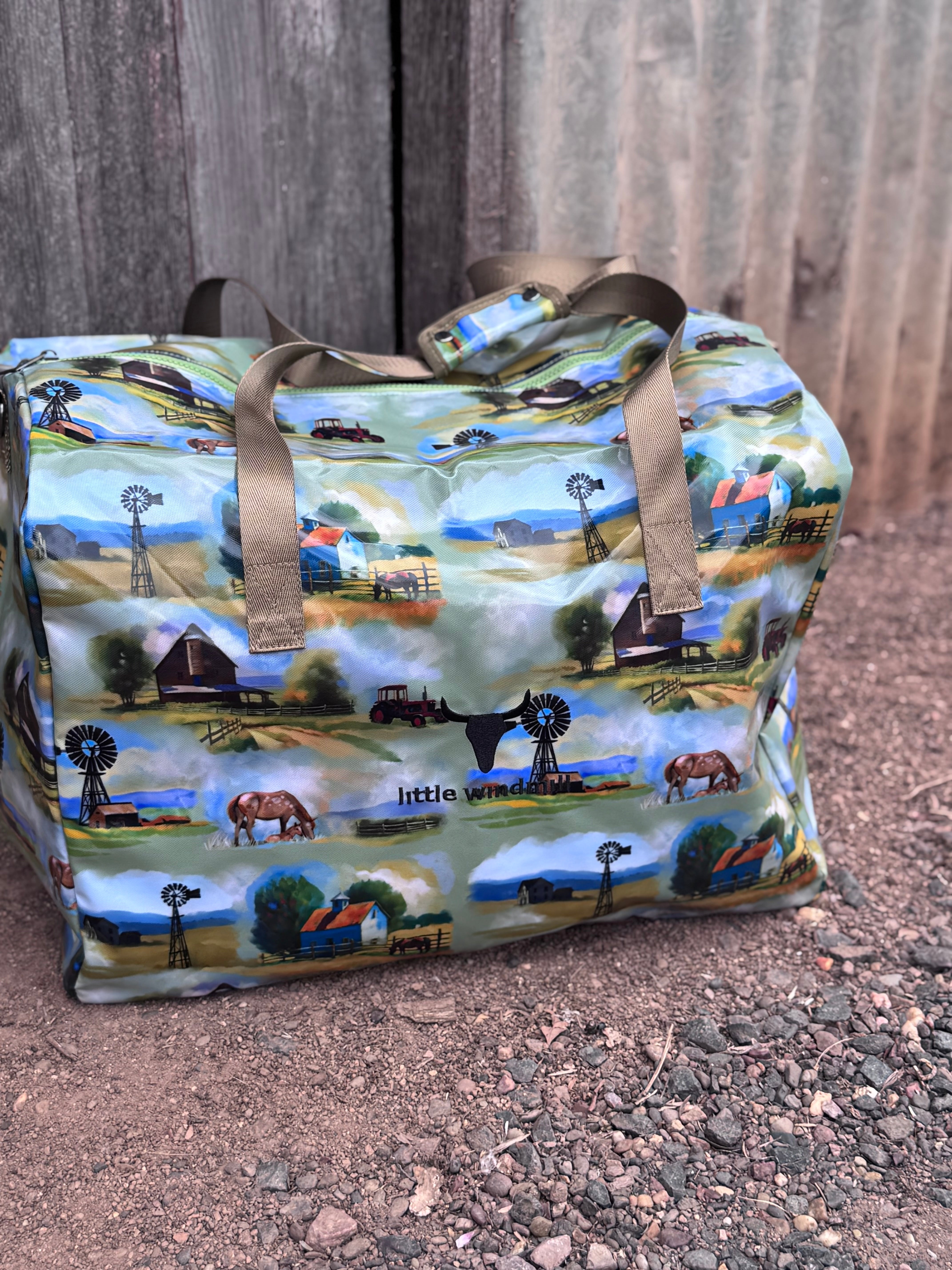Vintage farm scene duffle bag flatlay showing full nostalgic farm scene print design