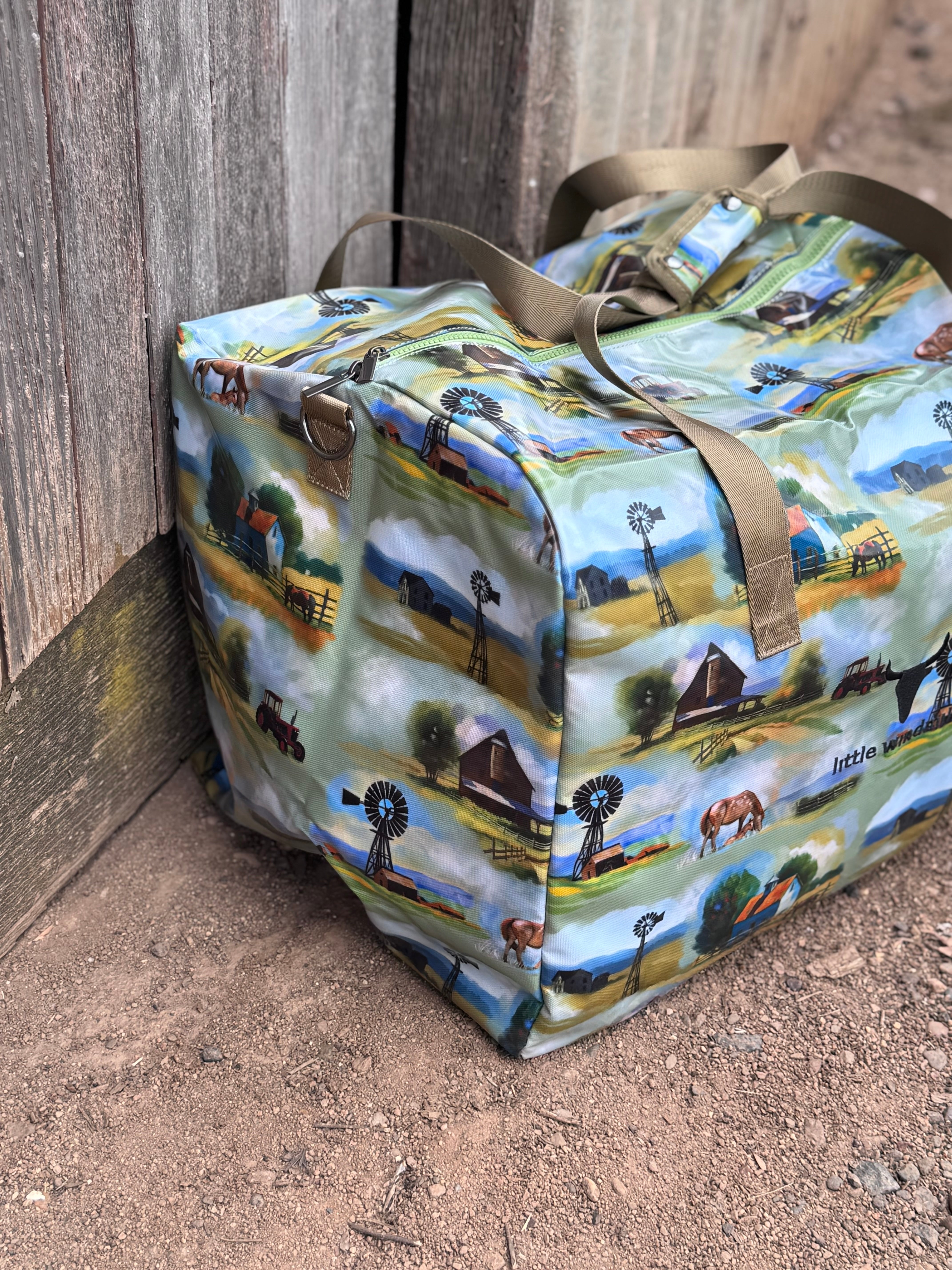 Vintage farm scene duffle bag print close-up showing detailed vintage farm scene illustration