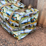 Vintage farm scene duffle bag open showing spacious interior and quality zip closure