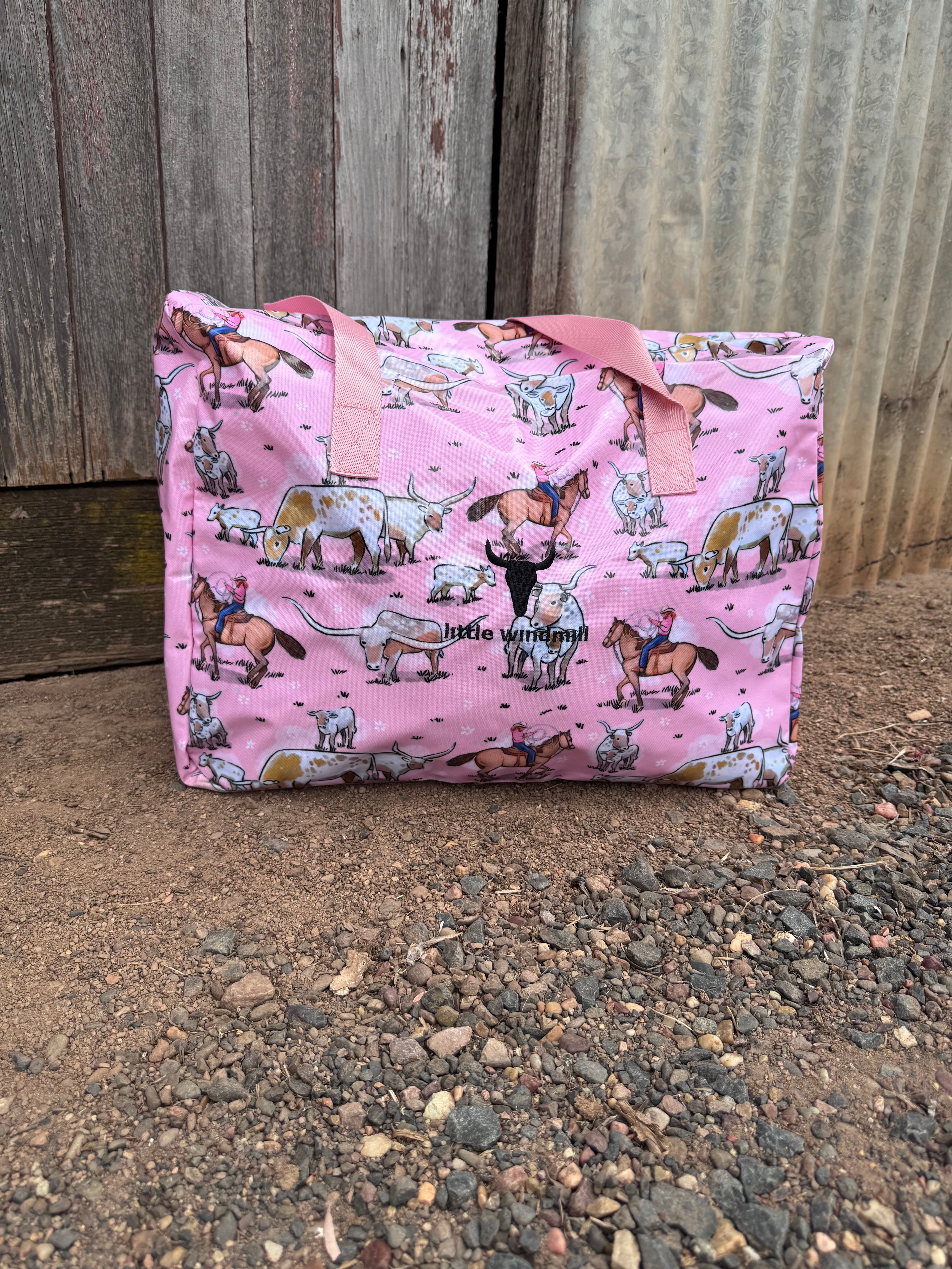 Pink longhorn duffle bag flatlay showing full vibrant longhorn print design